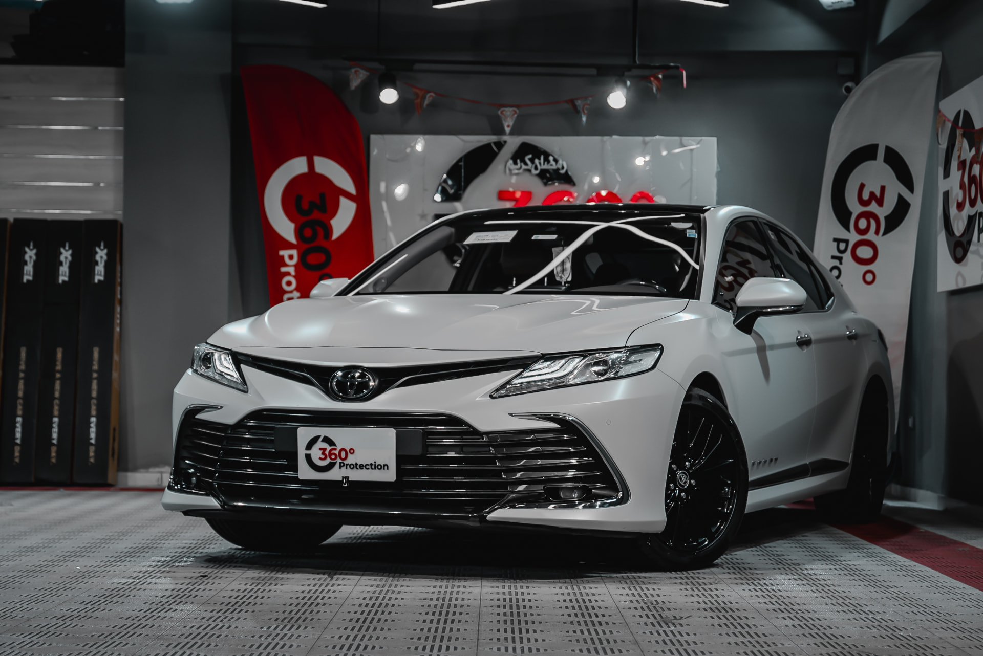 White Toyota Camry finished with paint protection