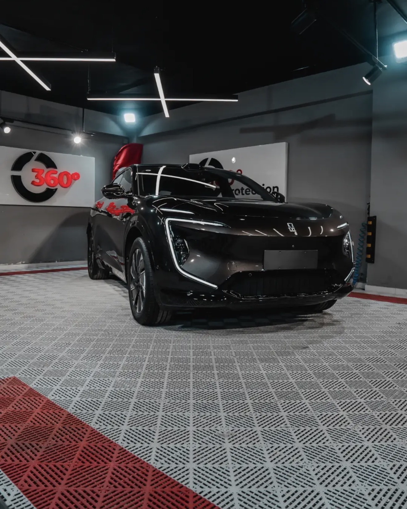 Black EV coupe SUV after protection detailing